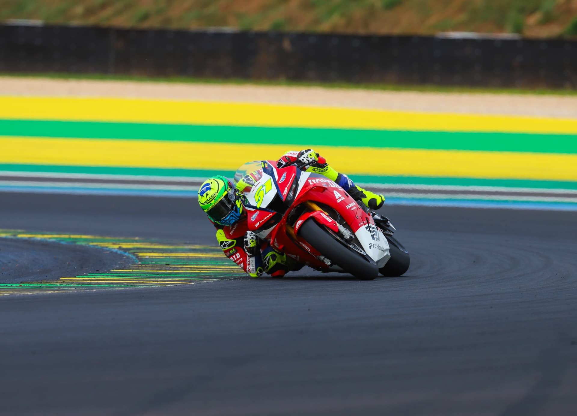 Honda Racing #51 clipping the green and yellow kerbs at Interlagos