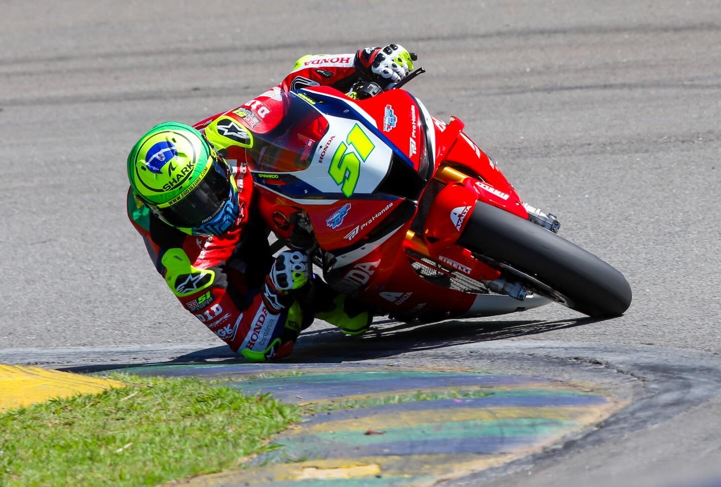 Honda Racing #51 knee down over the painted apex