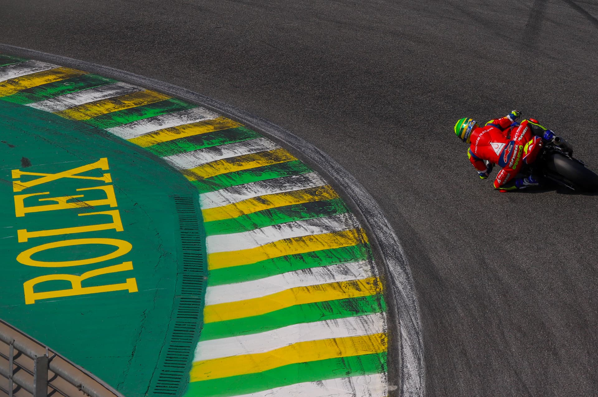 Rider clipping the Rolex kerb at Interlagos