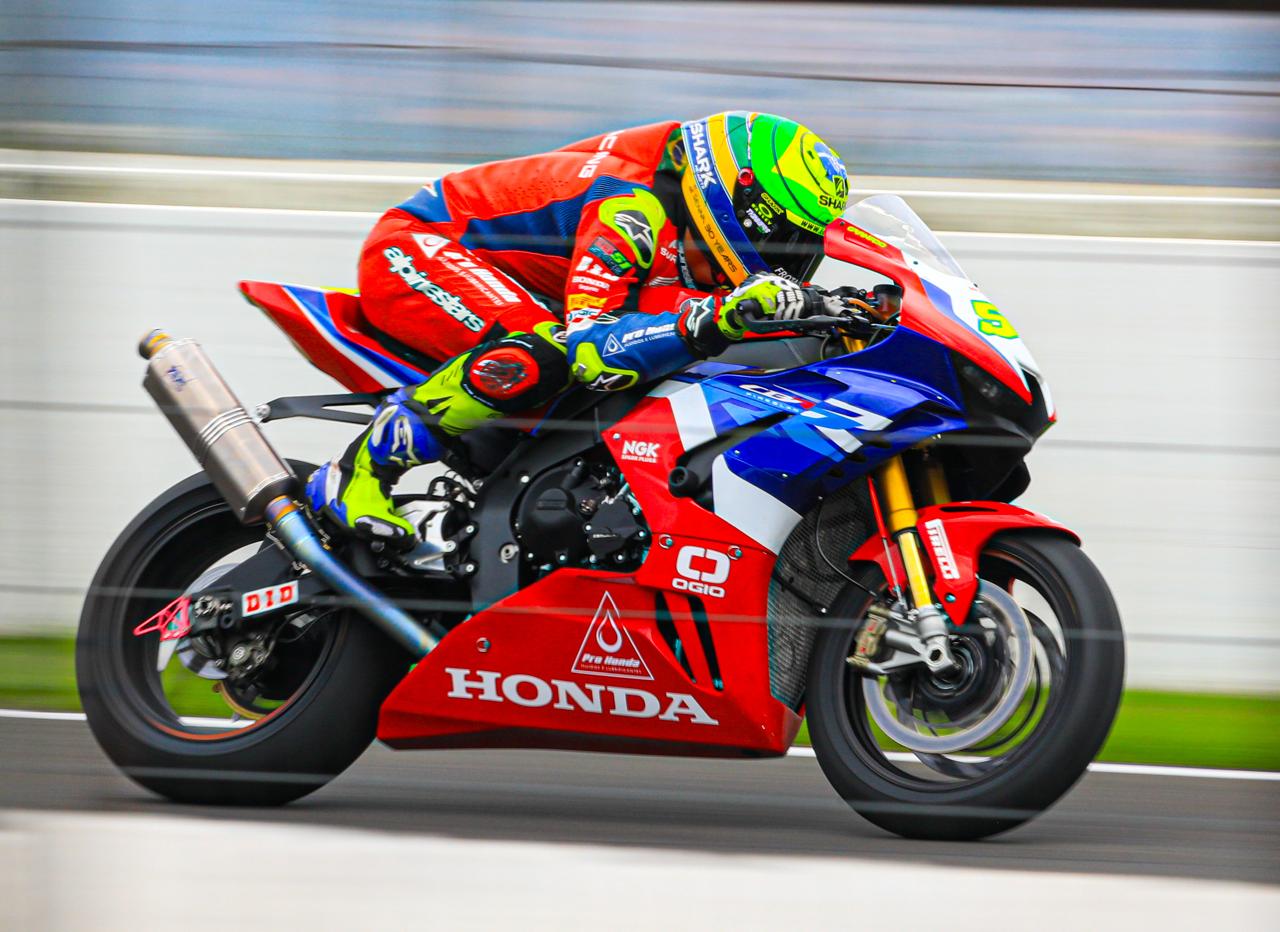 Honda CBR superbike at speed along the pit wall
