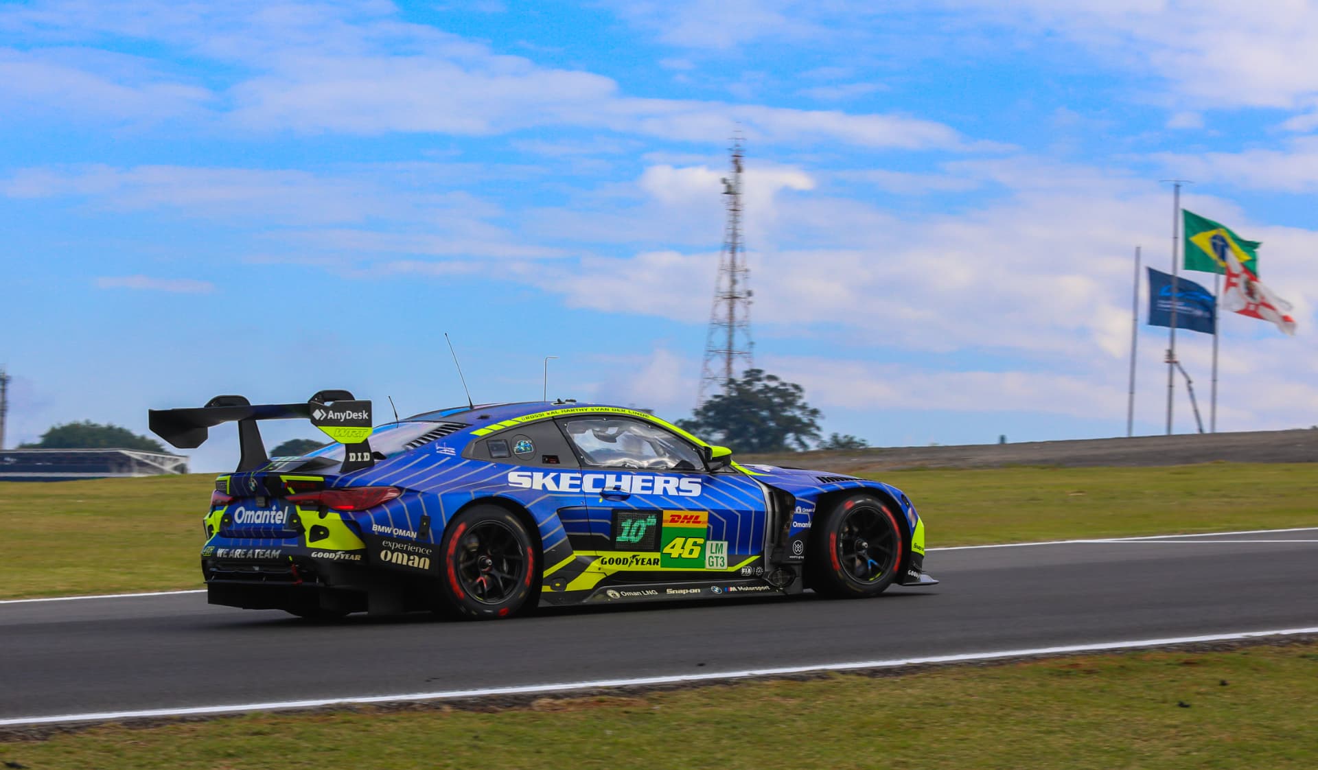 BMW M4 GT3 in Skechers livery with the flags in the background