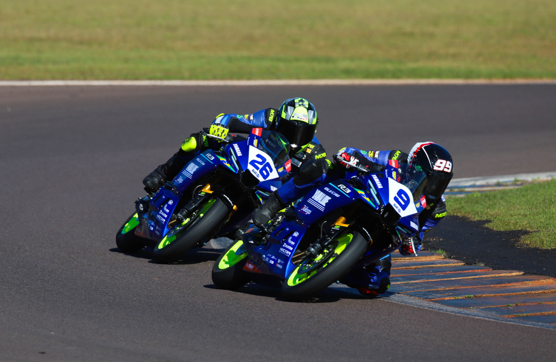 Three Yamaha R3 riders battling wheel to wheel